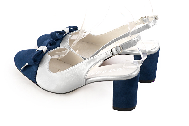 Navy blue and light silver women's open back shoes, with a knot. Round toe. Medium block heels. Rear view - Florence KOOIJMAN